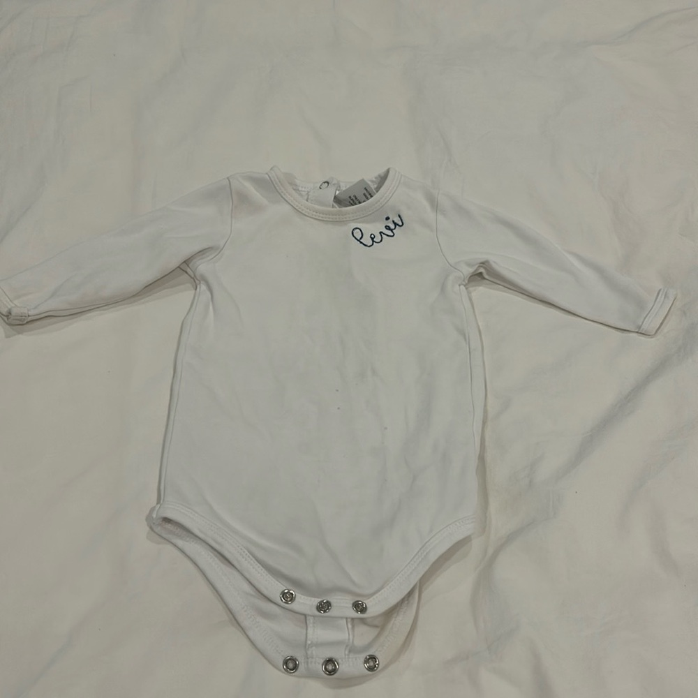 Monogrammed “Levi” long sleeve onesie with button back size 6-9 months